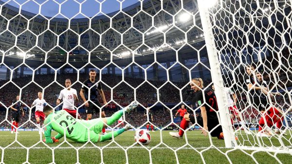 World Cup - Round of 16 - Croatia vs Denmark - Nizhny Novgorod Stadium, Nizhny Novgorod, Russia - July 1, 2018 Denmark's Mathias Jorgensen (hidden) scores their first goal past Croatia's Danijel Subasic - Sputnik International