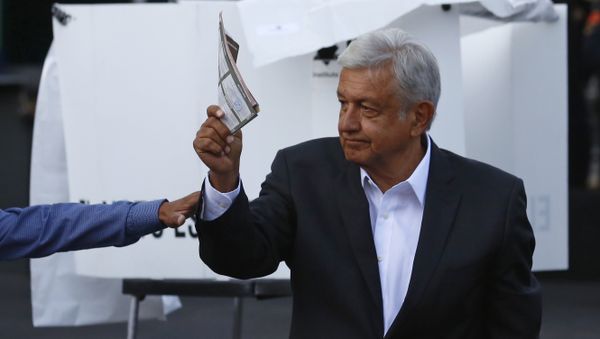 Presidential candidate Andres Manuel Lopez Obrador, of the MORENA party, shows his ballot to the press before casting it during general elections in Mexico City, Sunday, July 1, 2018. Sunday’s elections for posts at every level of government are Mexico’s largest ever and have become a referendum on corruption, graft and other tricks used to divert taxpayer money to officials’ pockets and empty those of the country’s poor - Sputnik International