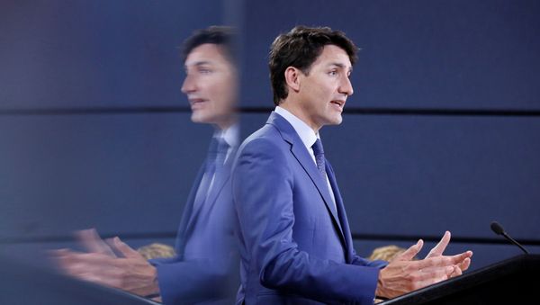 Canada's Prime Minister Justin Trudeau is reflected in a monitor while speaking during a news conference in Ottawa, Ontario, Canada, June 20, 2018 Canada's Prime Minister Justin Trudeau is reflected in a monitor while speaking during a news conference in Ottawa, Ontario, Canada, June 20, 2018 - Sputnik International