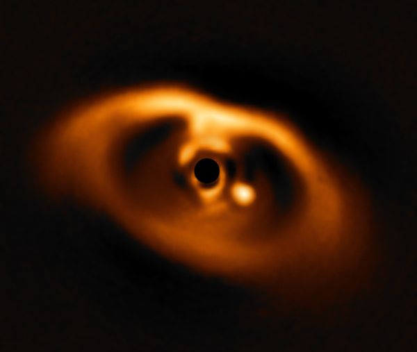 The photo provided by the European Southern Observatory ESO taken from the SPHERE instrument on ESO's Very Large Telescope is the first clear image of a planet caught in the very act of formation around the dwarf star PDS 70. - Sputnik International