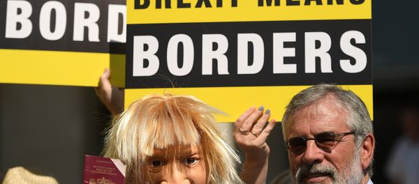 An actor wearing a Boris Johnson mask is joined by Sinn Fein's Gerry Adams during a 'Borders Against Brexit' protest in the border town of Dundalk, Ireland, June 28, 2018 An actor wearing a Boris Johnson mask is joined by Sinn Fein's Gerry Adams during a 'Borders Against Brexit' protest in the border town of Dundalk, Ireland, June 28, 2018 - Sputnik International