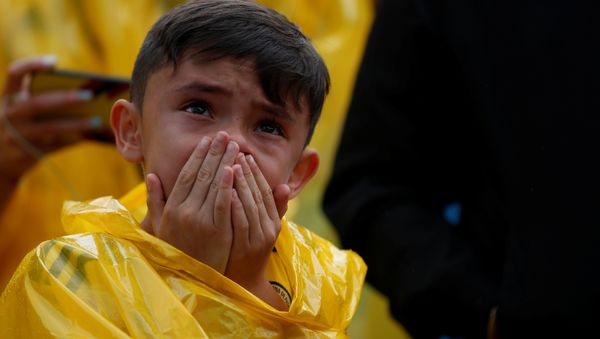 A Colombian fan reacts while watching the broadcast of the World Cup Round of 16 soccer match between Colombia and England in Bogota, Colombia July 3, 2018 - Sputnik International