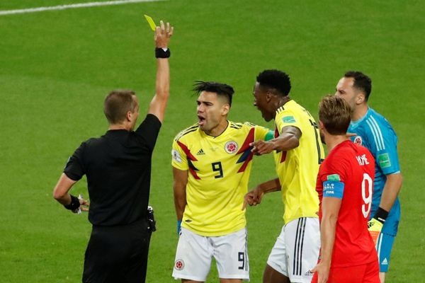 Soccer Football - World Cup - Round of 16 - Colombia vs England - Spartak Stadium, Moscow, Russia - July 3, 2018 Colombia's Radamel Falcao is shown a yellow card by referee Mark Geiger Soccer Football - World Cup - Round of 16 - Colombia vs England - Spartak Stadium, Moscow, Russia - July 3, 2018 Colombia's Radamel Falcao is shown a yellow card by referee Mark Geiger - Sputnik International