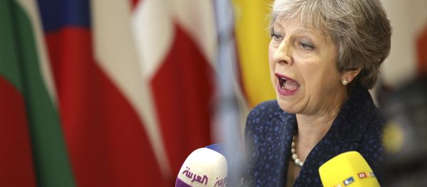 British Prime Minister Theresa May speaks with the media as she arrives for an EU summit at the Europa building in Brussels, Thursday, June 28, 2018. - Sputnik International