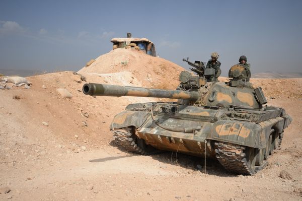 The crew of a T-72 tank of the 10th Division, 2nd Corps of the Syrian Arab Army are on combat alert off Katana, Damascus Province The crew of a T-72 tank of the 10th Division, 2nd Corps of the Syrian Arab Army are on combat alert off Katana, Damascus Province - Sputnik International