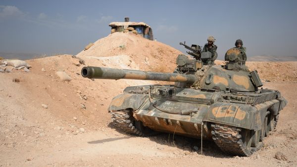 The crew of a T-72 tank of the 10th Division, 2nd Corps of the Syrian Arab Army are on combat alert off Katana, Damascus Province The crew of a T-72 tank of the 10th Division, 2nd Corps of the Syrian Arab Army are on combat alert off Katana, Damascus Province - Sputnik International