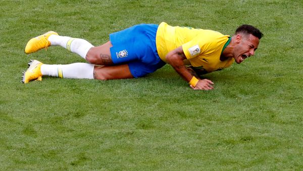 FILE PHOTO: World Cup - Round of 16 - Brazil vs Mexico - Samara Arena, Samara, Russia - July 2, 2018 Brazil's Neymar lies on the pitch after sustaining an injury - Sputnik International