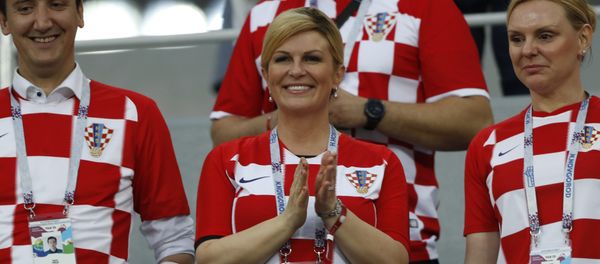 President Kolinda Grabar-Kitarovic, center, applauds prior the round of 16 match between Croatia and Denmark at the 2018 soccer World Cup in the Nizhny Novgorod Stadium, in Nizhny Novgorod , Russia, Sunday, July 1, 2018 - Sputnik International
