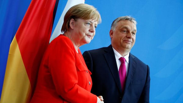 German Chancellor Angela Merkel and Hungarian Prime Minister Viktor Orban shake hands after addressing the media in Berlin, Germany, July 5, 2018 German Chancellor Angela Merkel and Hungarian Prime Minister Viktor Orban shake hands after addressing the media in Berlin, Germany, July 5, 2018 - Sputnik International