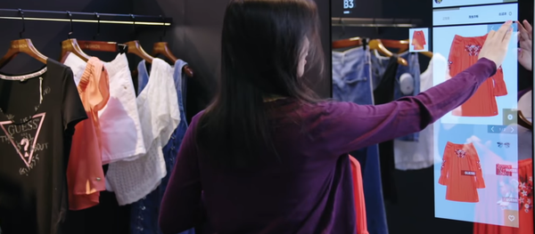 Woman Selects Clothing on Smart Mirror at Alibaba's FashionAI Store in Hong Kong Woman Selects Clothing on Smart Mirror at Alibaba's FashionAI Store in Hong Kong - Sputnik International