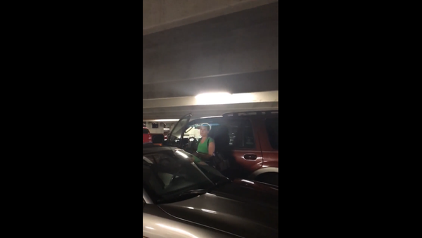 Georgia woman calls cops on black woman smoking in an outdoor parking garage Georgia woman calls cops on black woman smoking in an outdoor parking garage - Sputnik International
