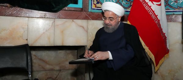 Iran's President Hassan Rouhani fills in his ballot Iran's President Hassan Rouhani fills in his ballot - Sputnik International