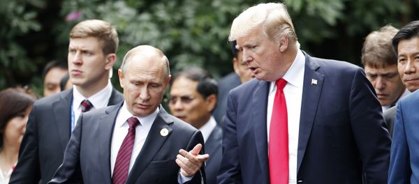 U.S. President Donald Trump, center right, and Russia's President Vladimir Putin, center left, talk during the family photo session at the APEC Summit in Danang, Saturday, Nov. 11, 2017 U.S. President Donald Trump, center right, and Russia's President Vladimir Putin, center left, talk during the family photo session at the APEC Summit in Danang, Saturday, Nov. 11, 2017 - Sputnik International