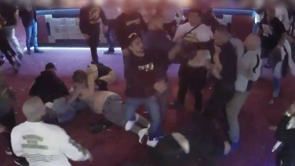 Surveillance footage shows a group of Comanchero, at Capital Mens Club early on August 20, 2017, when the shirts came off and a wild brawl erupted - Sputnik International