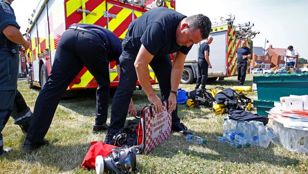 Fire and Rescue Service personel prepare safety equipment at the site of a housing estate on Muggleton Road, after it was confirmed that two people had been poisoned with the nerve-agent Novichok, in Amesbury, Britain, July 6, 2018. Fire and Rescue Service personel prepare safety equipment at the site of a housing estate on Muggleton Road, after it was confirmed that two people had been poisoned with the nerve-agent Novichok, in Amesbury, Britain, July 6, 2018. - Sputnik International