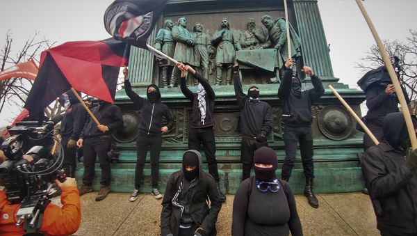 Anti-capitalist protesters rally in DC during US President Donald Trump's inauguration. - Sputnik International