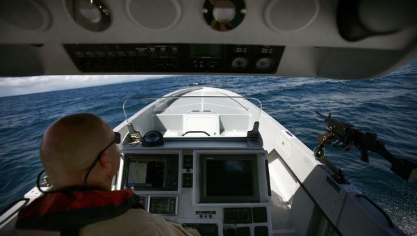 US Custom and Border Patrol Marine Interdiction Agency Supervisor Paul Pope shows the press a prototype boat during a test drive in Ceiba, Puerto Rico, Tuesday, Oct. 13, 2009. US Custom and Border Patrol Marine Interdiction Agency Supervisor Paul Pope shows the press a prototype boat during a test drive in Ceiba, Puerto Rico, Tuesday, Oct. 13, 2009. - Sputnik International