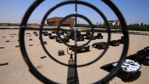 Syrian government forces' soldiers display weapons confiscated from the rebels in a Syrian army military base in the town of Ezraa, province of Daraa, on July 4, 2018 Syrian government forces' soldiers display weapons confiscated from the rebels in a Syrian army military base in the town of Ezraa, province of Daraa, on July 4, 2018 - Sputnik International