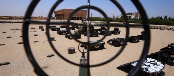 Syrian government forces' soldiers display weapons confiscated from the rebels in a Syrian army military base in the town of Ezraa, province of Daraa, on July 4, 2018 Syrian government forces' soldiers display weapons confiscated from the rebels in a Syrian army military base in the town of Ezraa, province of Daraa, on July 4, 2018 - Sputnik International