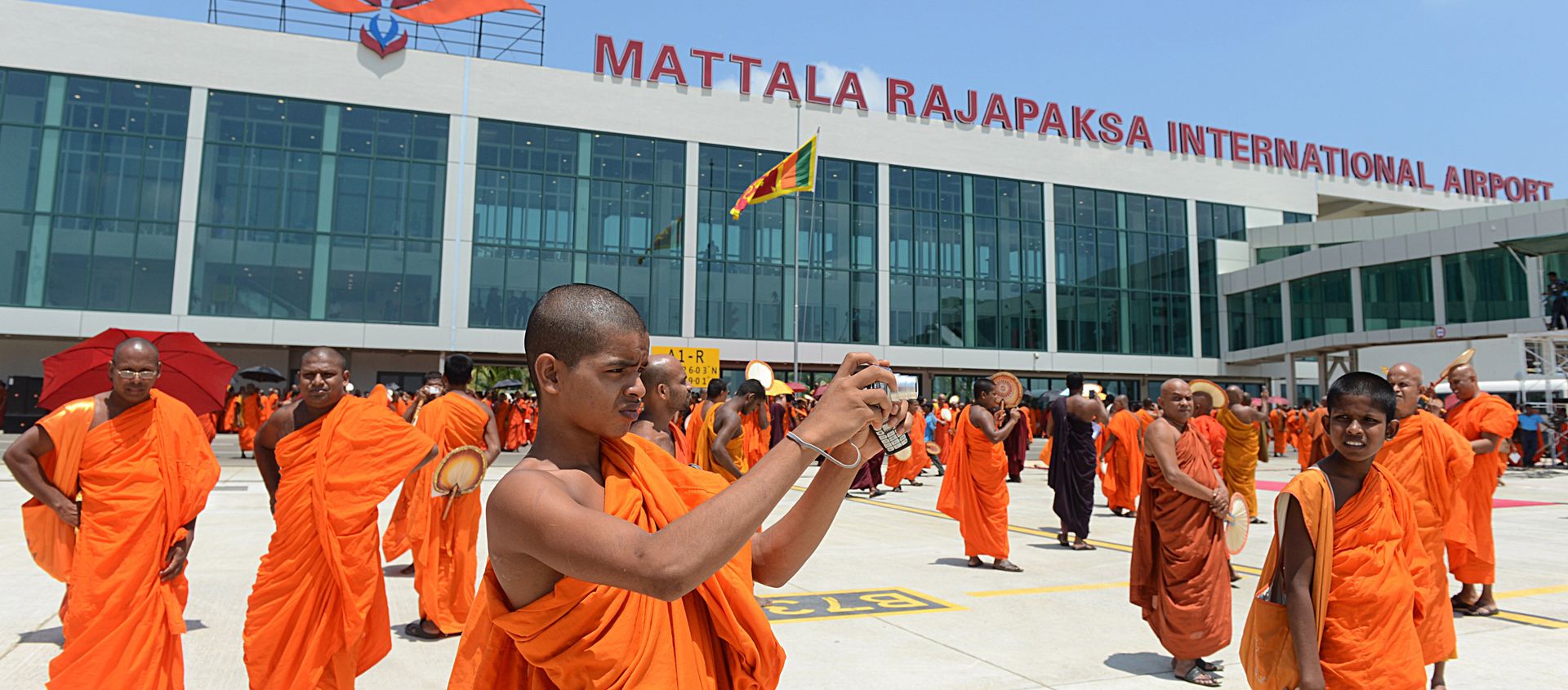 (File) A Sri Lankan Budhist monk takes pictures of an unseen Sri Lankan airlines Airbus A-340 which transported President Mahinda Rajapakse who became the first passenger to go through the facility, at the new Mattala Rajapaksa International Airport in Mattala, in the southeast of the island on March 18, 2013 - Sputnik International, 1920, 07.07.2018