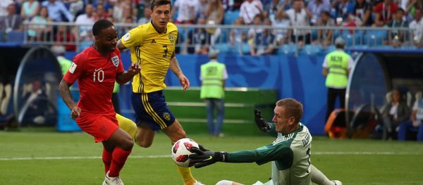 Sweden's goalkeeper Robin Olsen, right, makes a save against England's Raheem Sterling during the World Cup quarterfinal soccer match between Sweden and England at the Samara Arena, in Samara, Russia, July 7, 2018 Sweden's goalkeeper Robin Olsen, right, makes a save against England's Raheem Sterling during the World Cup quarterfinal soccer match between Sweden and England at the Samara Arena, in Samara, Russia, July 7, 2018 - Sputnik International