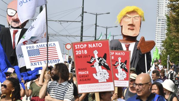 Protestors march next to giant puppets of U.S. President Donald Trump, right, and Belgian Prime Minister Charles Michel, left, during a demonstration in Brussels, Saturday, July 7, 2018 Protestors march next to giant puppets of U.S. President Donald Trump, right, and Belgian Prime Minister Charles Michel, left, during a demonstration in Brussels, Saturday, July 7, 2018 - Sputnik International