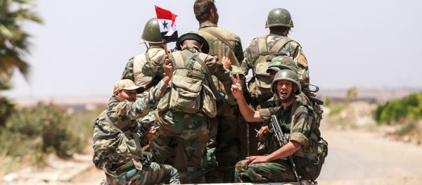 A Syrian government soldier flashes the victory gesture while riding in the back of a pickup truck with comrades at the Nassib border crossing with Jordan in the southern province of Daraa on July 7, 2018 A Syrian government soldier flashes the victory gesture while riding in the back of a pickup truck with comrades at the Nassib border crossing with Jordan in the southern province of Daraa on July 7, 2018 - Sputnik International