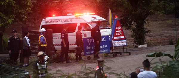 An ambulance leave the Tham Luang cave area after divers evacuated some of the 12 boys and their coach trapped at the cave in Khun Nam Nang Non Forest Park in the Mae Sai district of Chiang Rai province on July 8, 2018 An ambulance leave the Tham Luang cave area after divers evacuated some of the 12 boys and their coach trapped at the cave in Khun Nam Nang Non Forest Park in the Mae Sai district of Chiang Rai province on July 8, 2018 - Sputnik International