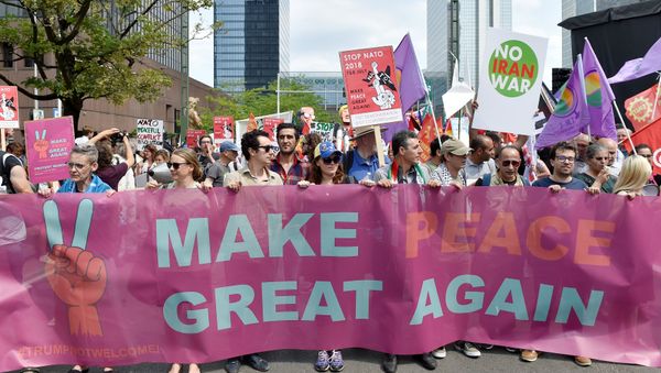Protesters take part in a march against the NATO leaders summit, in Brussels, Belgium July 7, 2018 Protesters take part in a march against the NATO leaders summit, in Brussels, Belgium July 7, 2018 - Sputnik International