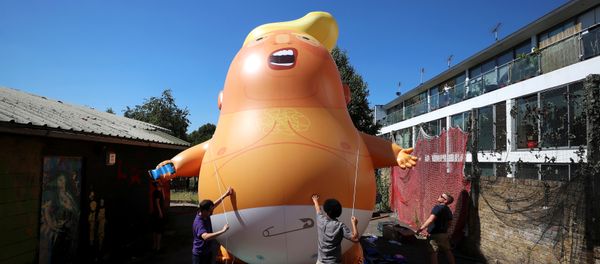 People inflate a helium filled Donald Trump blimp which they hope to deploy during The President of the United States' upcoming visit, in London, Britain, June 26, 2018 - Sputnik International