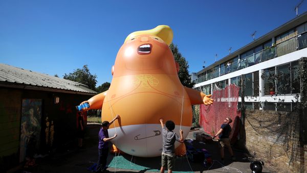 People inflate a helium filled Donald Trump blimp which they hope to deploy during The President of the United States' upcoming visit, in London, Britain, June 26, 2018 People inflate a helium filled Donald Trump blimp which they hope to deploy during The President of the United States' upcoming visit, in London, Britain, June 26, 2018 - Sputnik International