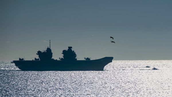The 65,000-tonne HMS Queen Elizabeth, the largest warships ever built for the Royal Navy of the United Kingdom, arrives at the British territory of Gibraltar on Friday, Feb. 9, 2018 - Sputnik International