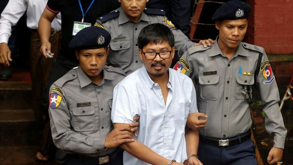 Detained Reuters journalist Wa Lone is escorted by police while leaving Insein court in Yangon, Myanmar July 9, 2018 Detained Reuters journalist Wa Lone is escorted by police while leaving Insein court in Yangon, Myanmar July 9, 2018 - Sputnik International