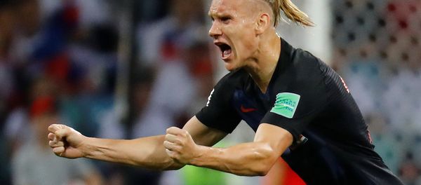 Soccer Football - World Cup - Quarter Final - Russia vs Croatia - Fisht Stadium, Sochi, Russia - July 7, 2018 Croatia's Domagoj Vida celebrates their first goal scored by Andrej Kramaric Soccer Football - World Cup - Quarter Final - Russia vs Croatia - Fisht Stadium, Sochi, Russia - July 7, 2018 Croatia's Domagoj Vida celebrates their first goal scored by Andrej Kramaric - Sputnik International