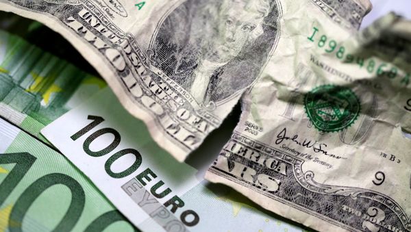 U.S. dollar and Euro banknotes are seen in this picture illustration taken May 3, 2018 - Sputnik International