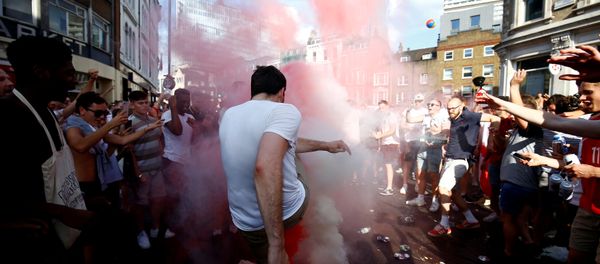 Soccer Football - World Cup - England fans watch Sweden vs England - London, Britain - July 7, 2018 England fans set off smoke bombs after the match - Sputnik International