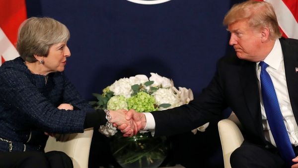 U.S. President Donald Trump shake hands with Britain's Prime Minister Theresa May during the World Economic Forum (WEF) annual meeting in Davos, Switzerland January 25, 2018 - Sputnik International