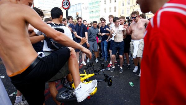World Cup - England fans watch Sweden vs England - London, Britain - July 7, 2018 England fans stamp on rent bicycle after the match - Sputnik International