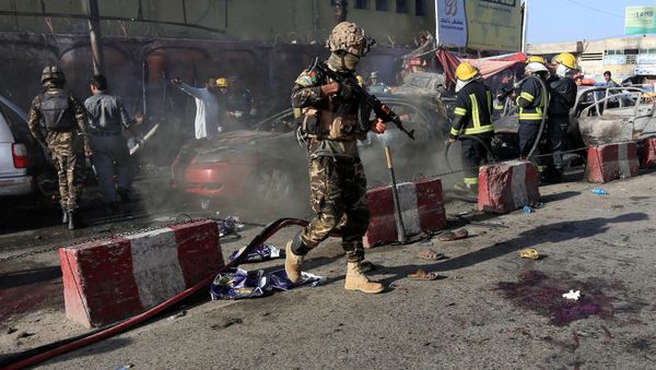 Afghan security forces inspect the site of a blast in Jalalabad city, Afghanistan, July 1, 2018 - Sputnik International