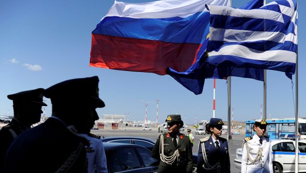 FILE PHOTO: Greek police and army officers stand by Greek, Russian and EU flags as they wait for the arrival of Russian President Vladimir Putin in Athens, Greece airport, May 27, 2016. FILE PHOTO: Greek police and army officers stand by Greek, Russian and EU flags as they wait for the arrival of Russian President Vladimir Putin in Athens, Greece airport, May 27, 2016. - Sputnik International