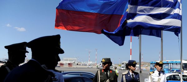 FILE PHOTO: Greek police and army officers stand by Greek, Russian and EU flags as they wait for the arrival of Russian President Vladimir Putin in Athens, Greece airport, May 27, 2016. FILE PHOTO: Greek police and army officers stand by Greek, Russian and EU flags as they wait for the arrival of Russian President Vladimir Putin in Athens, Greece airport, May 27, 2016. - Sputnik International
