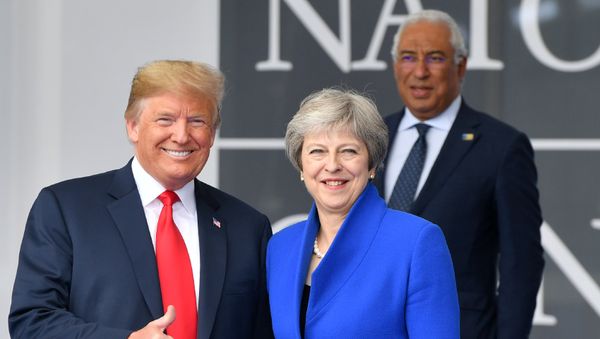 US President Donald Trump (L) gestures as he poses alongside Britain's Prime Minister Theresa May (R) as Portugal's Prime Minister Antonio Costa (TOP) looks on during the opening ceremony of the NATO (North Atlantic Treaty Organization) summit, at the NATO headquarters in Brussels, on July 11, 2018. US President Donald Trump (L) gestures as he poses alongside Britain's Prime Minister Theresa May (R) as Portugal's Prime Minister Antonio Costa (TOP) looks on during the opening ceremony of the NATO (North Atlantic Treaty Organization) summit, at the NATO headquarters in Brussels, on July 11, 2018. - Sputnik International