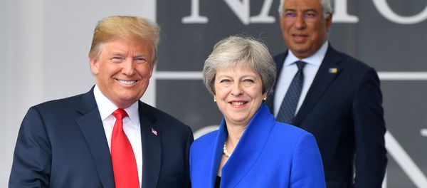 US President Donald Trump (L) gestures as he poses alongside Britain's Prime Minister Theresa May (R) as Portugal's Prime Minister Antonio Costa (TOP) looks on during the opening ceremony of the NATO (North Atlantic Treaty Organization) summit, at the NATO headquarters in Brussels, on July 11, 2018. - Sputnik International