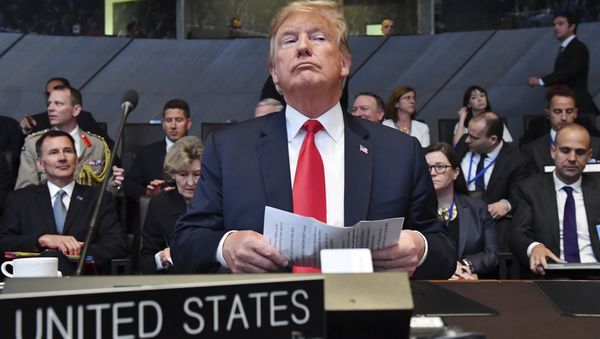 U.S. President Donald Trump attends a meeting of the North Atlantic Council during a summit of heads of state and government at NATO headquarters in Brussels on Wednesday, July 11, 2018. - Sputnik International
