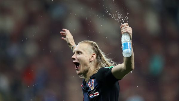 Soccer Football - World Cup - Semi Final - Croatia v England - Luzhniki Stadium, Moscow, Russia - July 11, 2018 Croatia's Domagoj Vida celebrates after the match Soccer Football - World Cup - Semi Final - Croatia v England - Luzhniki Stadium, Moscow, Russia - July 11, 2018 Croatia's Domagoj Vida celebrates after the match - Sputnik International