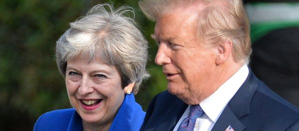 Britain's Prime Minister Theresa May and U.S. President Donald Trump during a meeting of NATO Heads of State and Government in Brussels, Belgium on July 12, 2018 - Sputnik International