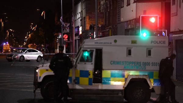 A car containing a suspect device is cordoned off by police in the middle of a road in East Belfast ahead of Twelfth of July celebrations held by members of Loyalist Orders in Belfast, Northern Ireland July 11, 2018 - Sputnik International
