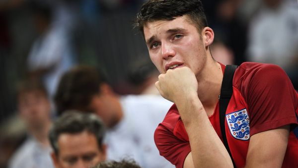Dejected England's fan reacts after team's 1-2 loss at the World Cup semifinal soccer match between Croatia and England, at the Luzhniki stadium, in Moscow, Russia, July 11, 2018. Dejected England's fan reacts after team's 1-2 loss at the World Cup semifinal soccer match between Croatia and England, at the Luzhniki stadium, in Moscow, Russia, July 11, 2018. - Sputnik International