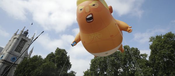 A six-meter high cartoon baby blimp of U.S. President Donald Trump is flown as a protest against his visit, in Parliament Square in London, England, Friday, July 13, 2018 A six-meter high cartoon baby blimp of U.S. President Donald Trump is flown as a protest against his visit, in Parliament Square in London, England, Friday, July 13, 2018 - Sputnik International