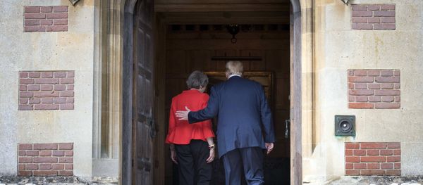 British Prime Minister Theresa May greets U.S President Donald Trump before their meeting at Chequers, in Buckinghamshire, England, Friday, July 13, 2018. - Sputnik International